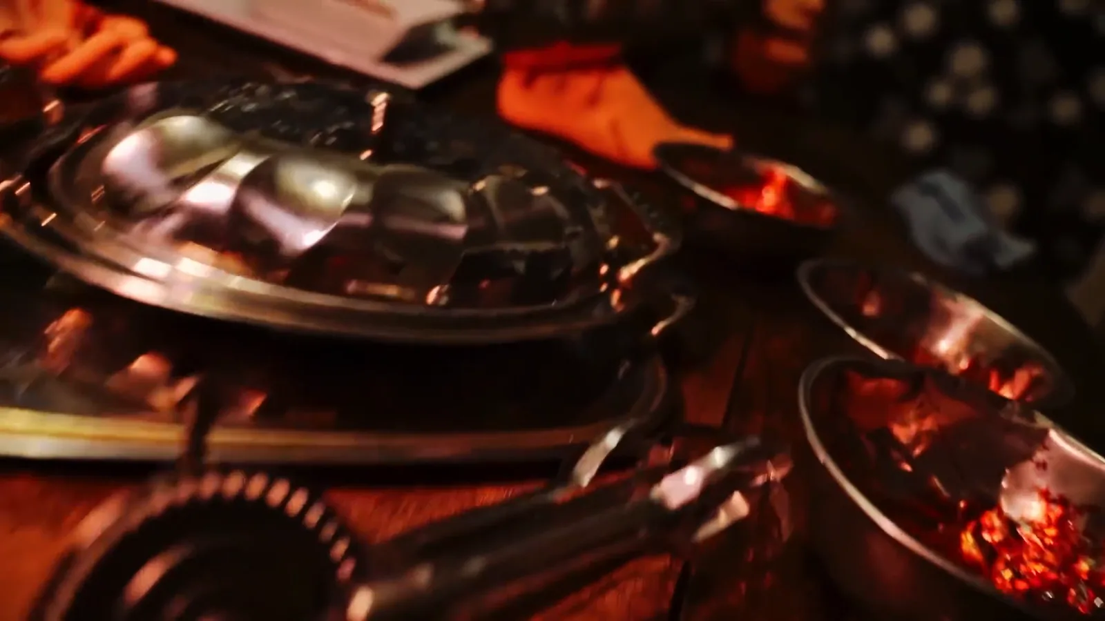 Silver serving platters laid out in the Cannibal dining room